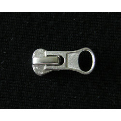 zip slider- metal- size 5 -  silver, placed on a black background