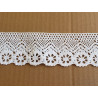 white cotton lace trim - 5cm wide, placed on a beige background