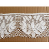 white cotton lace trim - 11cm wide, placed on a beige background