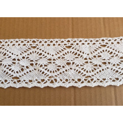 white cotton lace trim - 8,5cm wide, placed on a beige background