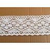 white cotton lace trim - 8,5cm wide, placed on a beige background