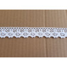 white cotton lace trim - 8,5cm wide, placed on a beige background