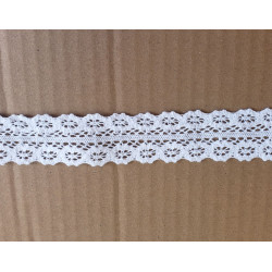 white cotton lace trim - 8,5cm wide, placed on a beige background