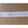 white cotton lace trim - 8,5cm wide, placed on a beige background