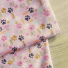 The  mini dog's paws on light pink - fully waterproof fabric  with a fold across the frame.