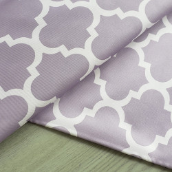Water-resistant canvas - Moroccan Quatrefoil - pale lilac, placed on the table with a fold
