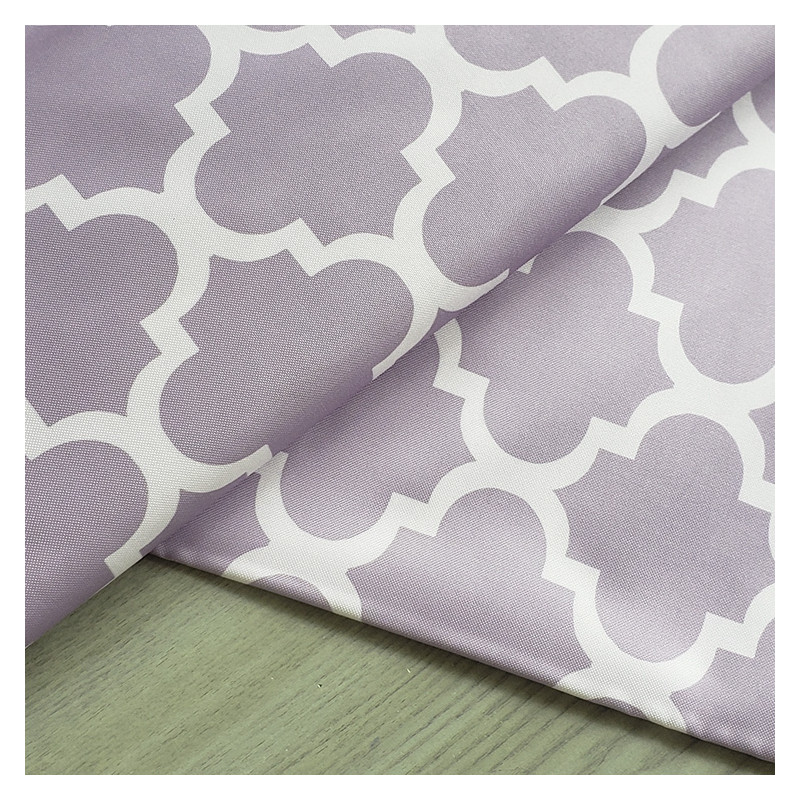 Water-resistant canvas - Moroccan Quatrefoil - pale lilac, placed on the table with a fold