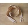 double slider chunky zip - beige 
 color, 85cm long, twisted on the wooden background