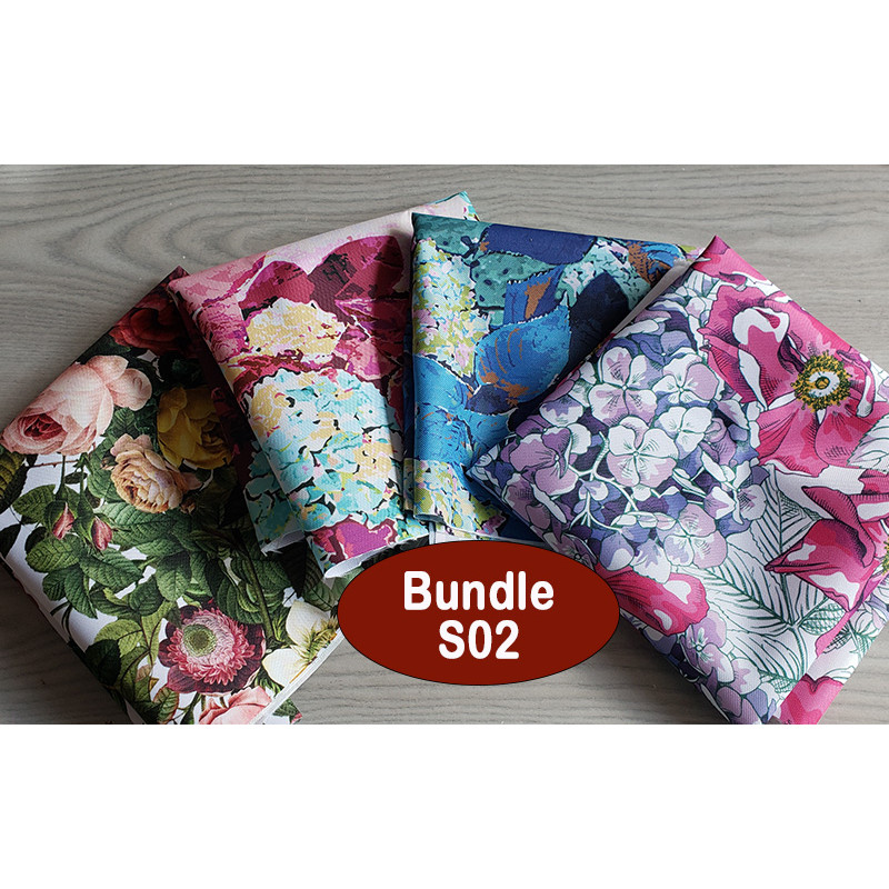 Outdoor fabric remnants bundle - mix of floral patterns, placed on a wooden table