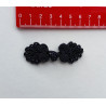 Frog fastener- black with beads, placed on a white background with a red ruler to show the size
