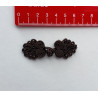Frog fastener- dark brown with beads, placed on a white background with a red ruler to show the size