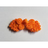 Frog fastener- orange with beads, placed on a white background