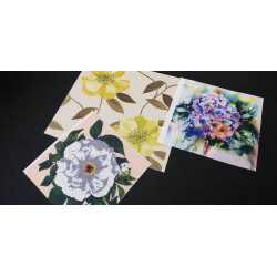 Cotton canvas remnants bundle - floral designs - 3 pieces of the fabric, placed on a dark background