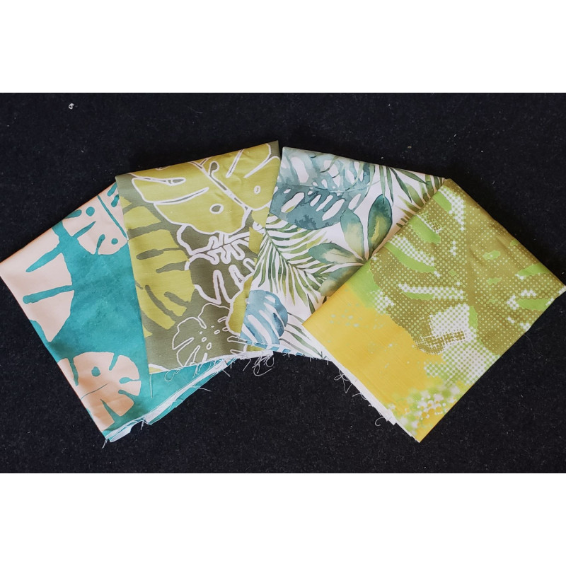 Cotton canvas remnants bundle - tropical monstera design- 4 pieces of the fabric placed on a dark background