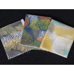 Cotton canvas remnants bundle - tropical monstera design- 3 pieces of the fabric placed on a dark background