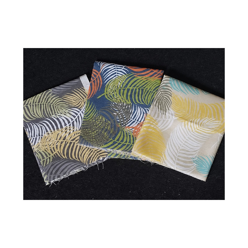 Cotton canvas remnants bundle - tropical monstera design- 3 pieces of the fabric placed on a dark background