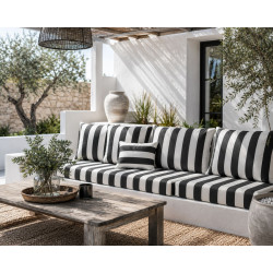Patio with furniture upholstered in black and white fabric